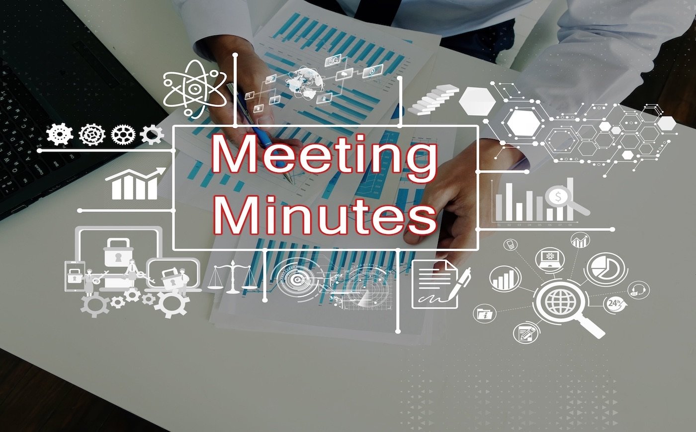 'Meeting Minutes' over a desk with charts, reports, and project-management icons